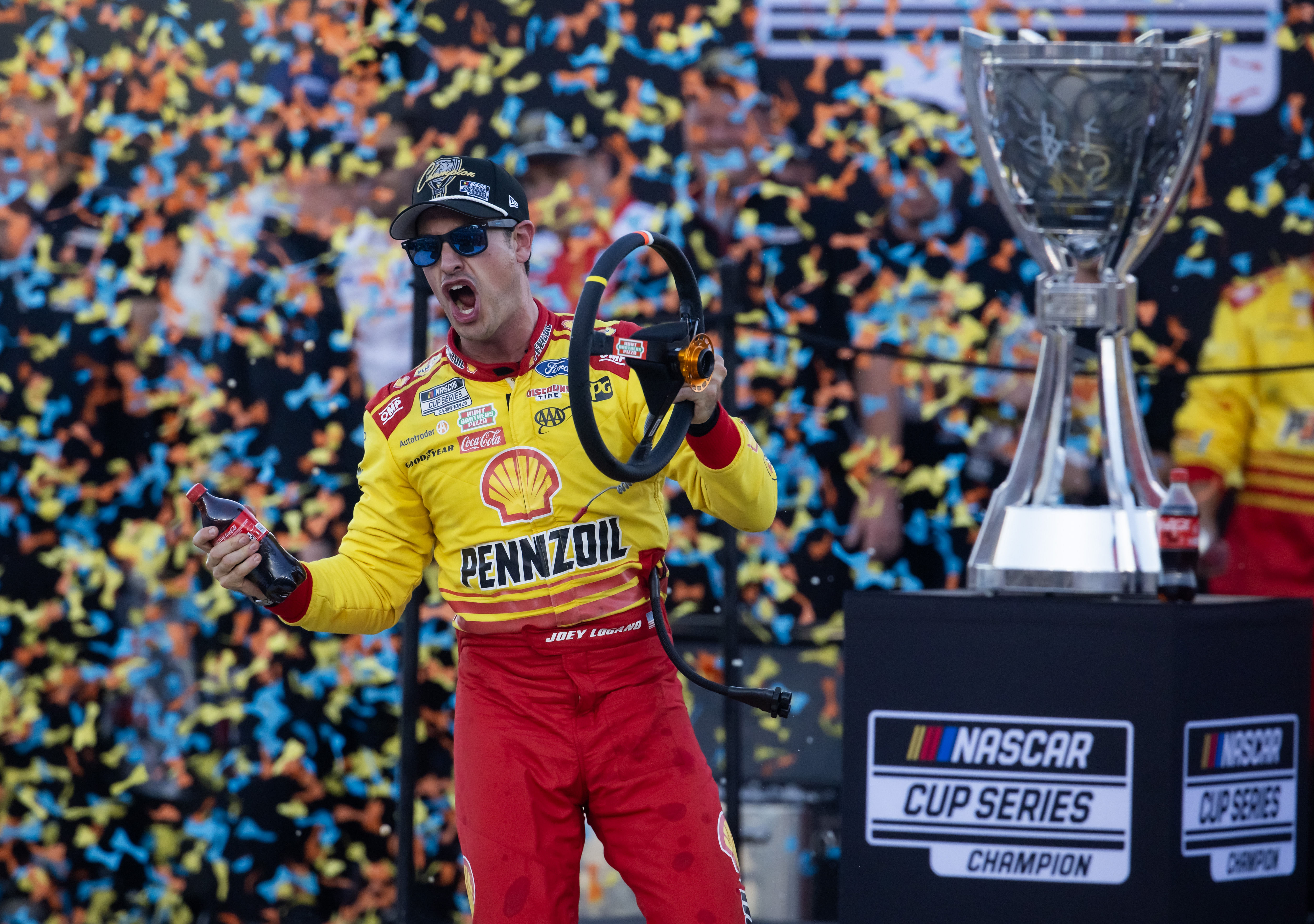 Joey Logano celebrates after winning the 2024 NASCAR Cup Series championship. Source: Imagn